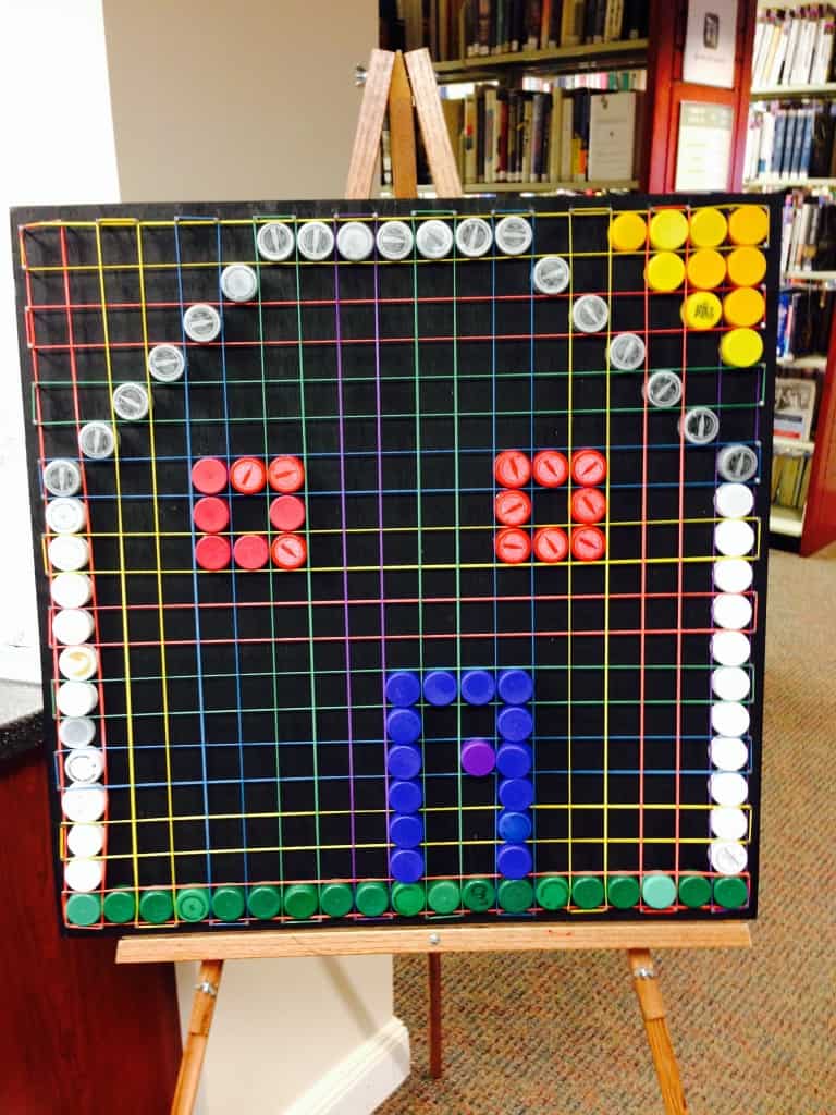House made on bottle-cap mosaic board