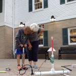 a paper rocket ready to be launched from the library patio,