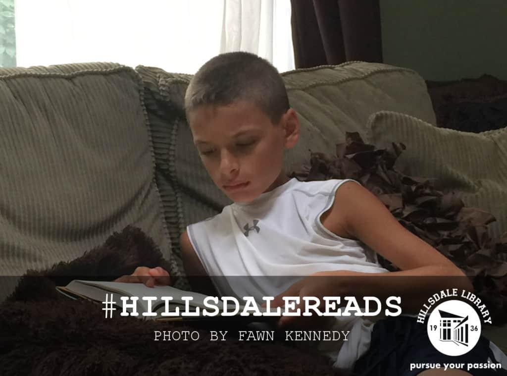 Staying cool reading on a hot day. Photo by Fawn Kennedy