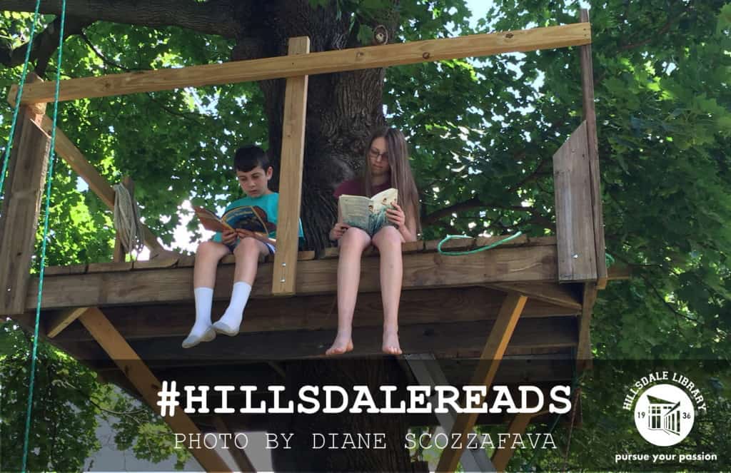 Reading in a treehouse, somewhere in Hillsdale. Photo by Diane Scozzafava.