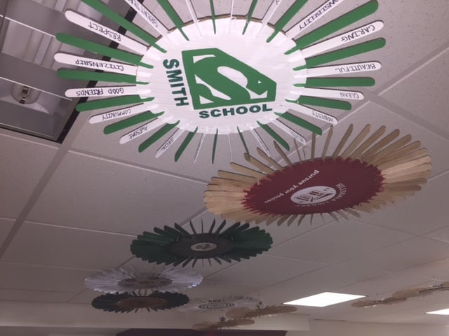 Working gear sculpture hanging from Hillsdale Library ceiling