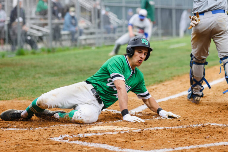 A Pascack Valley High School baseball player slides into home plate.