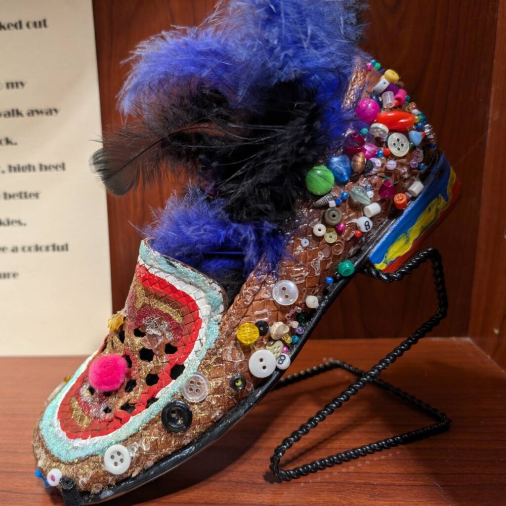 A shoe adorned with buttons and flowers.