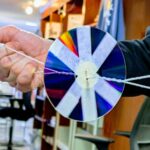 a twirling compact disc on a string.