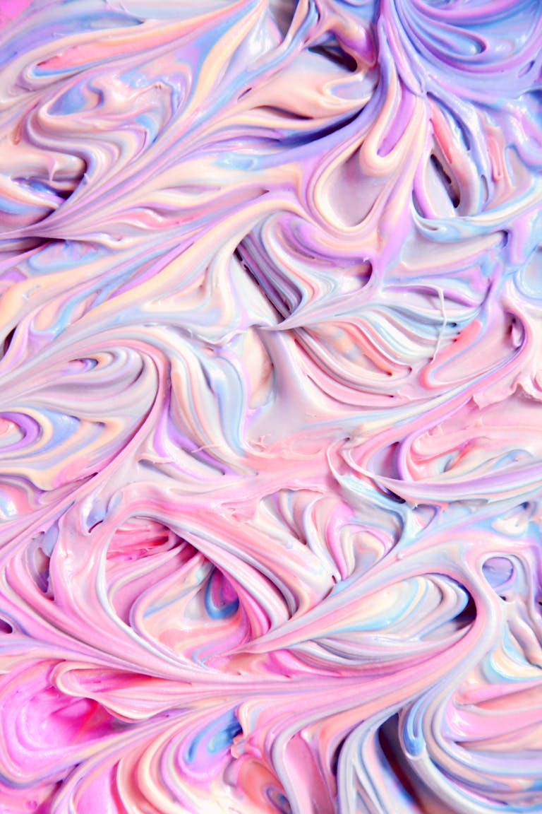 Vibrant swirled pastel texture resembling frosting or icing. Perfect for creative and dreamy backgrounds.