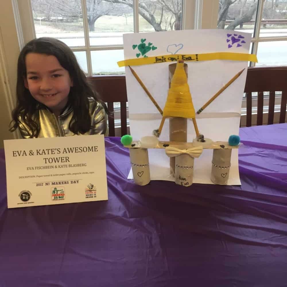 Tower made from paper towel and toilet paper rolls, popsicle sticks, and tape