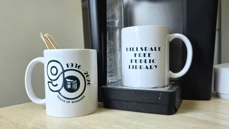 Hillsdale Library 90th anniversary mug at coffee maker
